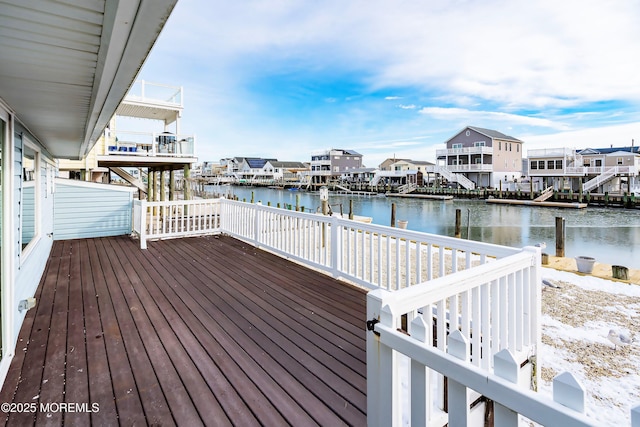 wooden terrace with a water view