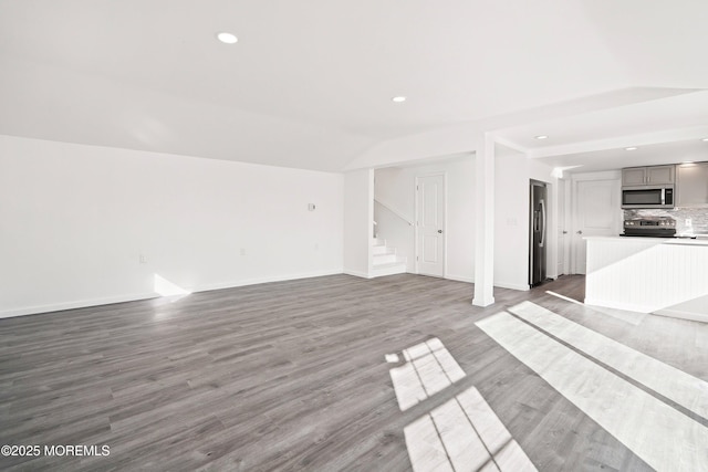 unfurnished living room with hardwood / wood-style flooring