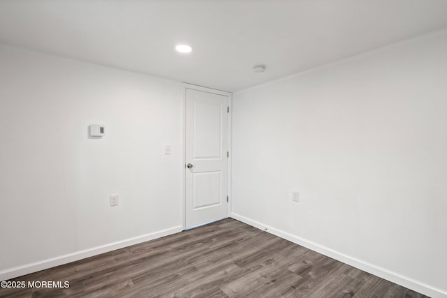 unfurnished room featuring dark hardwood / wood-style flooring