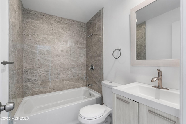 full bathroom featuring toilet, vanity, and tiled shower / bath combo