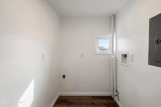 washroom featuring electric panel, dark wood-type flooring, hookup for a washing machine, and hookup for an electric dryer