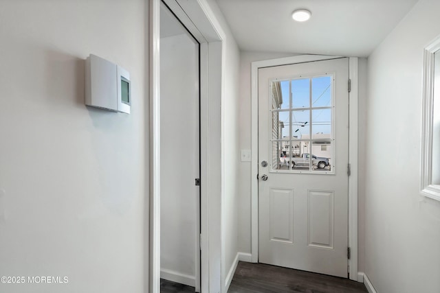 entryway with dark hardwood / wood-style flooring