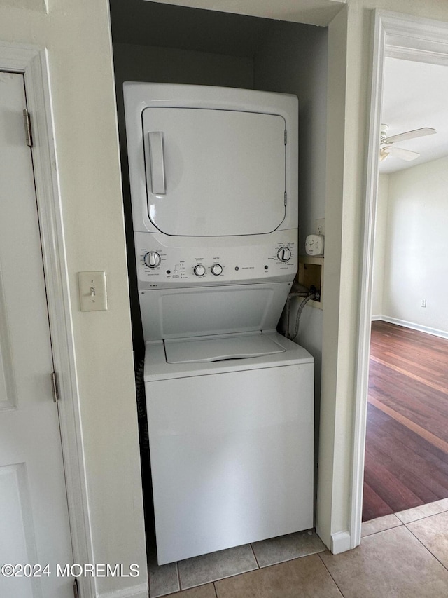 7 Point Rd, Toms River, NJ 08753 - clothes washing area with ceiling fan, light tile patterned floors, and stacked washer and dryer