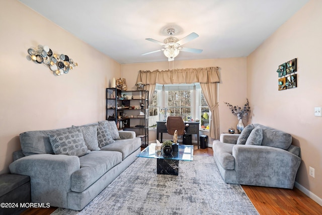 living room with hardwood / wood-style floors and ceiling fan