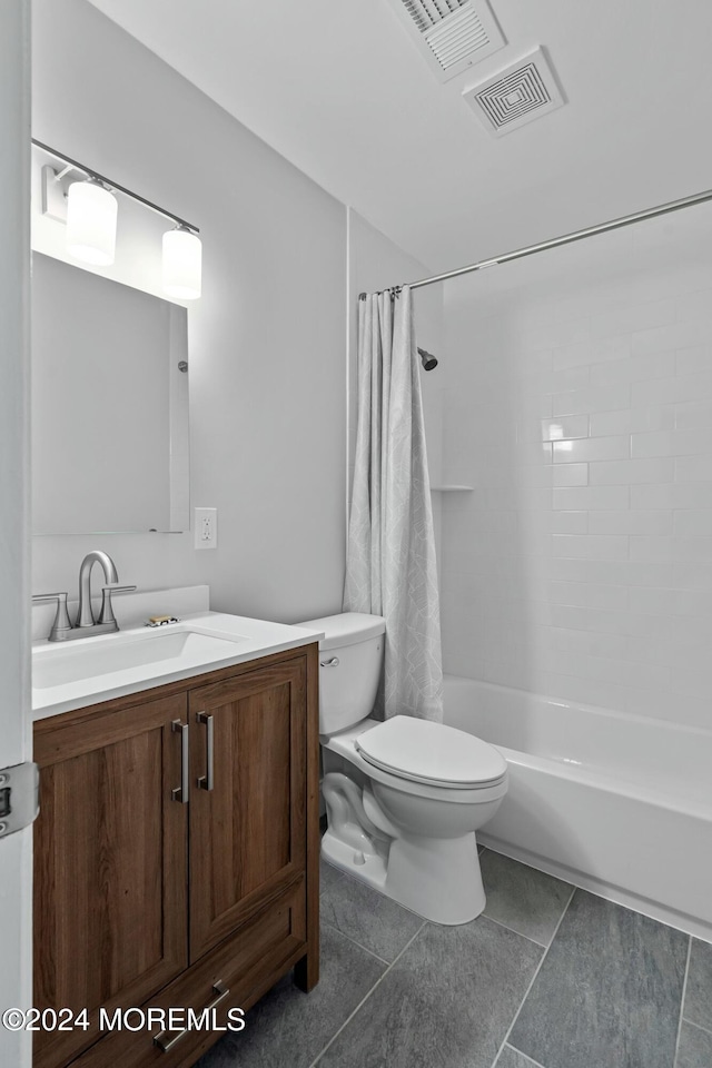 full bathroom featuring toilet, shower / bath combination with curtain, vanity, and tile patterned floors