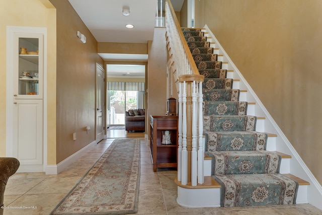 stairway featuring tile patterned floors