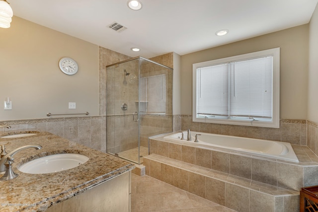 bathroom featuring tile patterned floors, vanity, and independent shower and bath