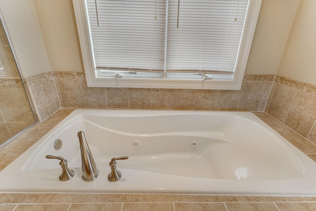 bathroom with a relaxing tiled tub