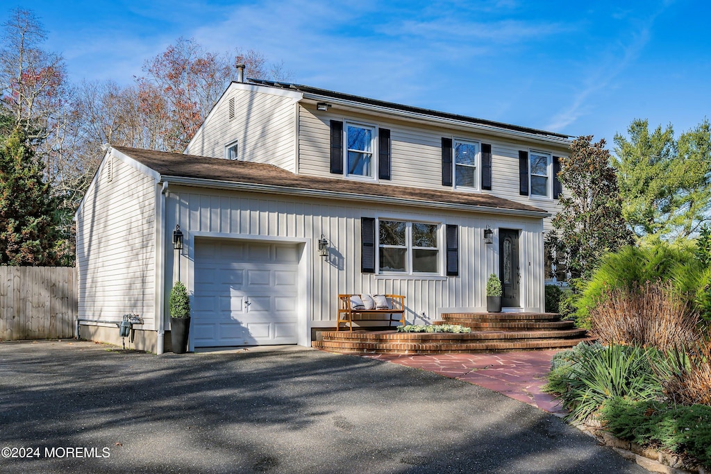 front of property with a garage