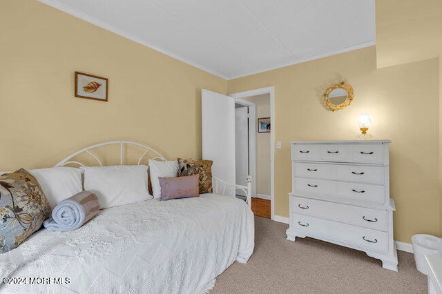 bedroom featuring light colored carpet