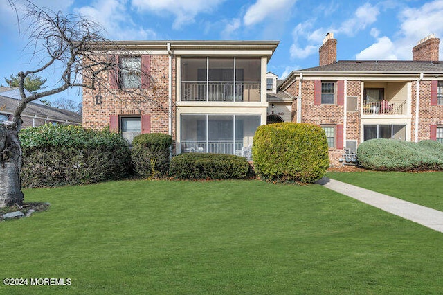 view of front of property with a front lawn