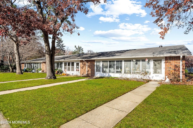 ranch-style house with a front yard