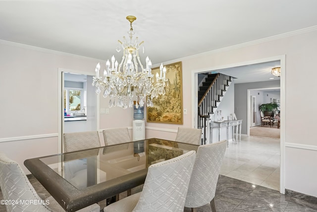 dining room featuring a notable chandelier and ornamental molding