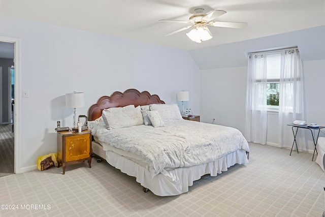 bedroom with carpet, ceiling fan, and lofted ceiling