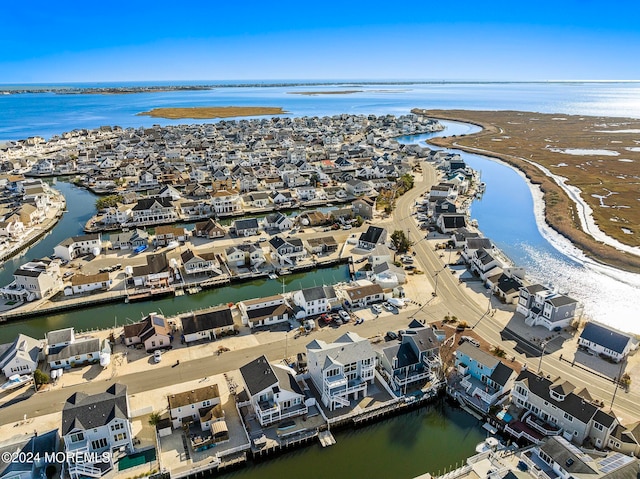 aerial view with a water view and a view of the beach