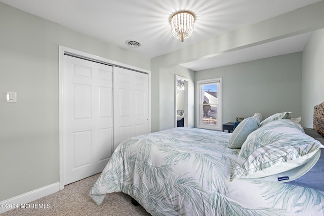 carpeted bedroom featuring a closet