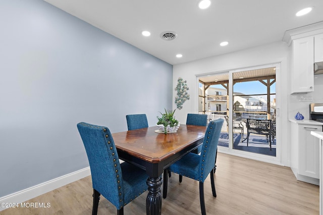 dining space featuring light hardwood / wood-style floors