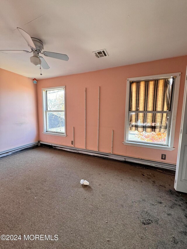 spare room with carpet flooring and ceiling fan