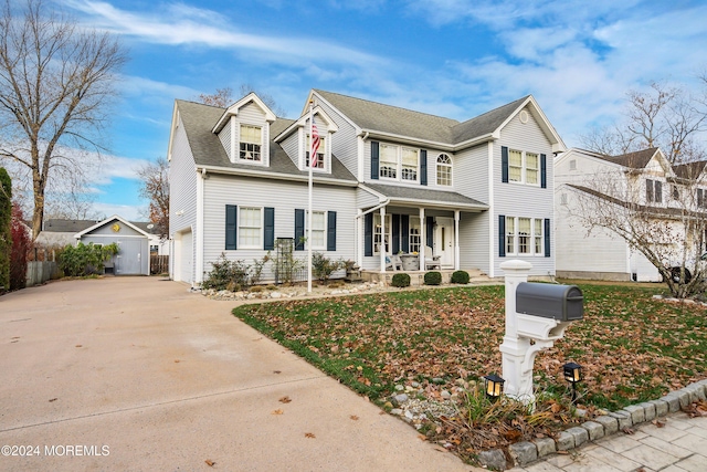 view of front of house with covered porch and a garage