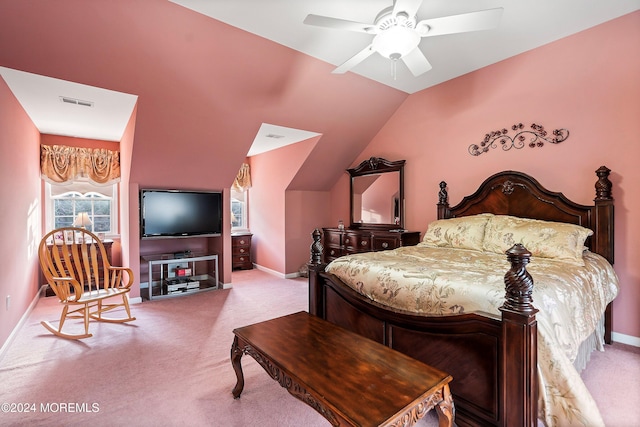 bedroom featuring ceiling fan, light carpet, and vaulted ceiling