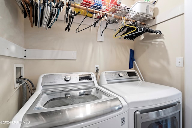 washroom featuring washing machine and dryer