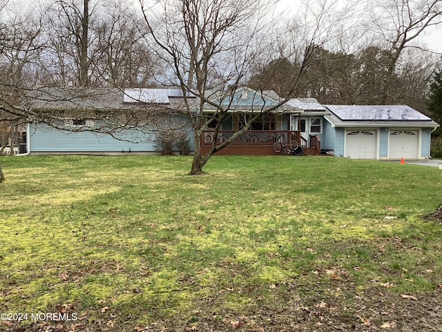 view of front of house with a garage and a front yard