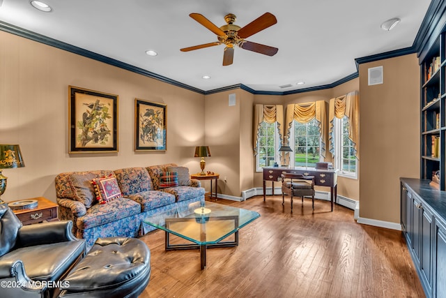 living room featuring baseboard heating, crown molding, hardwood / wood-style floors, and ceiling fan