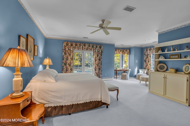 carpeted bedroom with ceiling fan, ornamental molding, and a baseboard heating unit