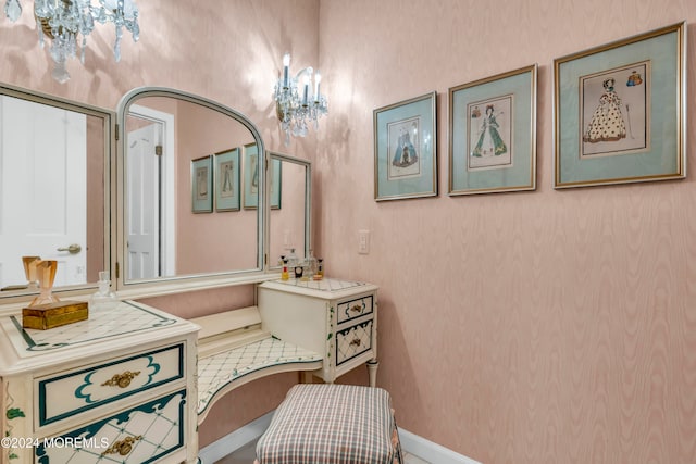 bathroom with a chandelier