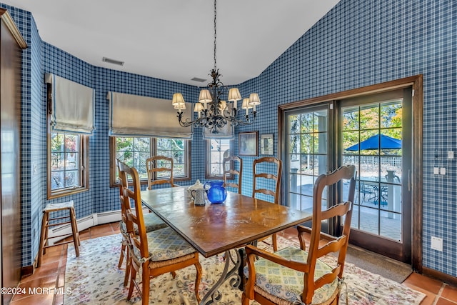 tiled dining area featuring a baseboard radiator, vaulted ceiling, and a notable chandelier