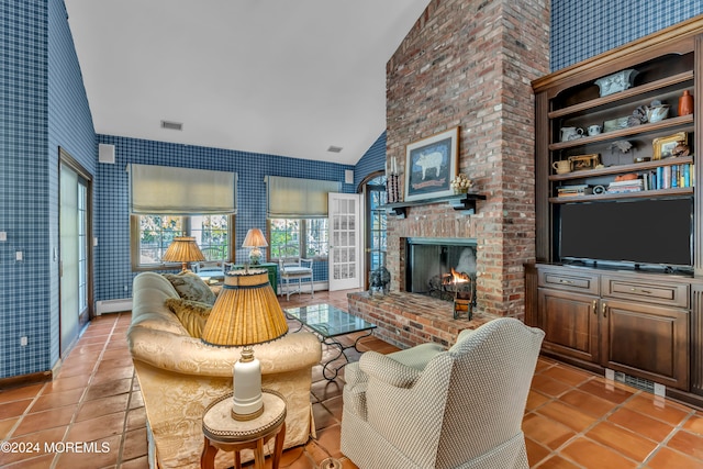 tiled living room with a brick fireplace, baseboard heating, and vaulted ceiling