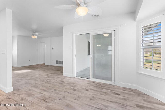 unfurnished room with ceiling fan and light hardwood / wood-style flooring