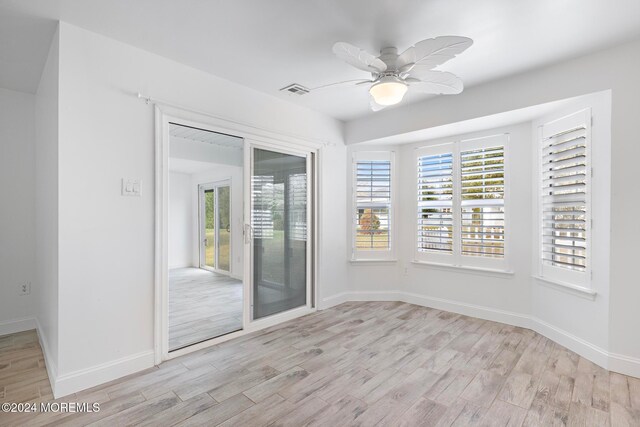 unfurnished room featuring ceiling fan and light hardwood / wood-style flooring