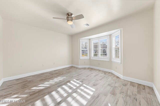 spare room featuring ceiling fan and light wood-type flooring