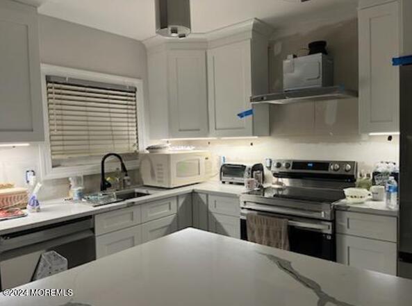 kitchen with white cabinets and electric stove