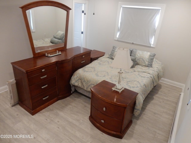 bedroom with light hardwood / wood-style flooring