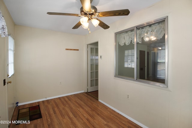 unfurnished room featuring hardwood / wood-style flooring and ceiling fan