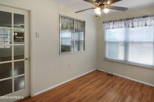 unfurnished room featuring hardwood / wood-style flooring and ceiling fan