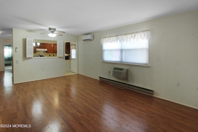 unfurnished living room with ceiling fan, dark hardwood / wood-style flooring, baseboard heating, and a wall unit AC