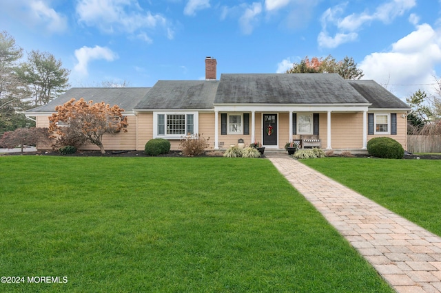 single story home featuring a front yard and a porch