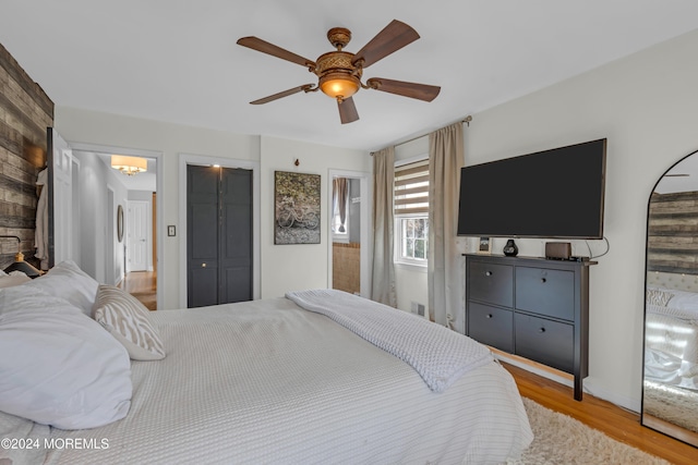 bedroom featuring light hardwood / wood-style floors and ceiling fan