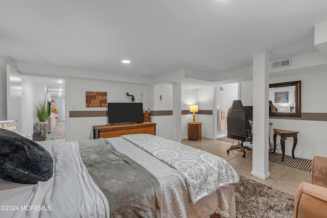 bedroom featuring light tile patterned floors