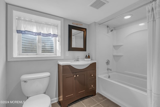 full bathroom with tile patterned floors, vanity, toilet, and shower / tub combo