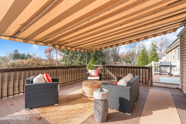 wooden terrace featuring an outdoor living space