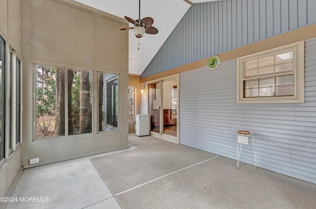 unfurnished sunroom featuring ceiling fan and lofted ceiling