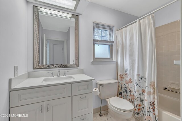 full bathroom featuring tile patterned flooring, vanity, toilet, and shower / bath combo