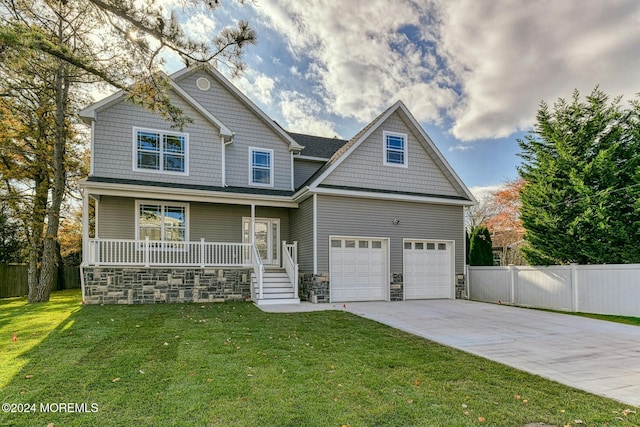 craftsman house featuring a porch, a garage, and a front lawn