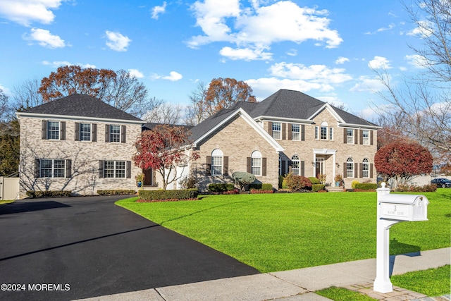 colonial home with a front yard