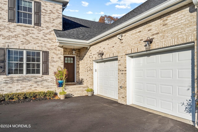 property entrance with a garage