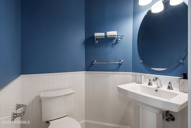 bathroom featuring toilet and radiator